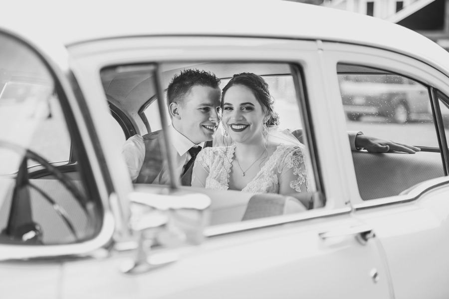 bride and groom vintage car