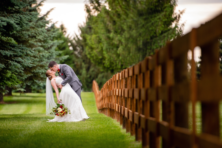 Pine View Acres Wedding by fence 