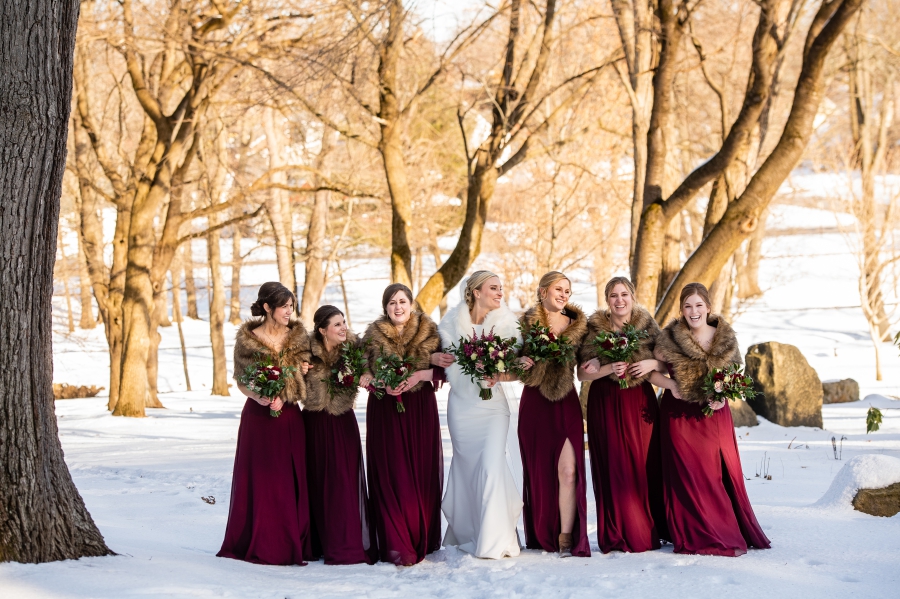 maroon bridesmaids dresses with furs 
